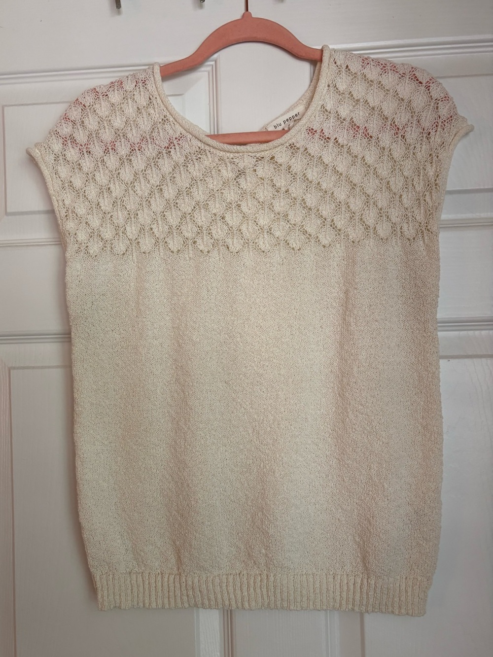 Soft, delicate cream-colored short-sleeved knit top by Blu Pepper